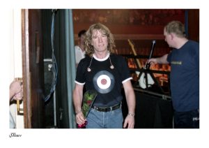 Rick Parfitt coming off stage with rose stage, Status Quo #007